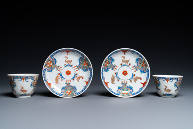 A pair of Chinese famille rose cups and saucers with aquatic birds, Qianlong