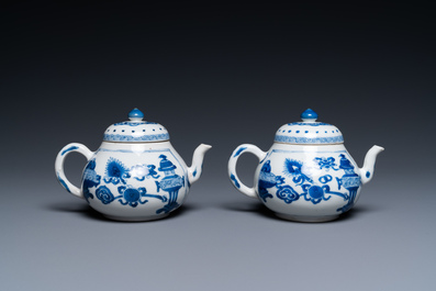 A pair of Chinese blue and white 'antiquities' teapots, Kangxi