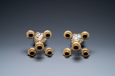 A pair of Chinese gilt brass candelabra-mounted Canton famille rose vases, 19th C.
