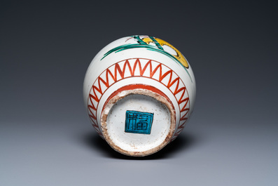 A Japanese Ko-Imari bottle vase in Ko-Kutani-style with a rooster, a hen and their chick, probably Edo, late 17th C.