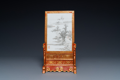 A Chinese famille rose table screen with a winter landscape and a scene with Europeans, various seals, Qianlong mark, 18/19th C.