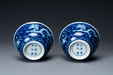A pair of Chinese blue and white 'dragon' bowls, Kangxi mark, 19/20th C.
