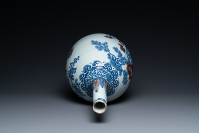 A Chinese blue, white and copper-red bottle vase with a deer and birds among blossoming branches, Daoguang