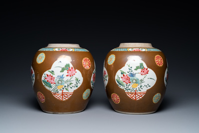 A pair of Chinese famille rose capucin brown-ground jars, Qianlong