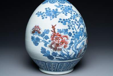 A Chinese blue, white and copper-red bottle vase with a deer and birds among blossoming branches, Daoguang