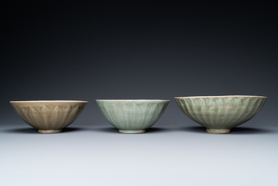 Three Chinese celadon-glazed 'lotus' bowls, Song