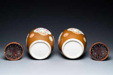 A pair of Chinese famille rose capucin brown-ground jars, Qianlong