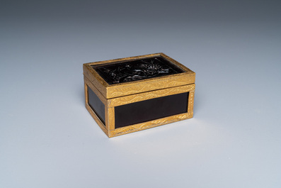 A Chinese gilt-copper box set with glass plaques, Beijing Imperial workshops, Qianlong