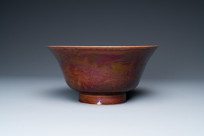 A Chinese aubergine-glazed bowl with incised design of cranes, Kangxi