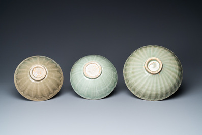Three Chinese celadon-glazed 'lotus' bowls, Song