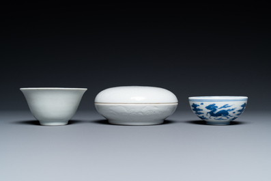 A Chinese white-glazed bowl, a small blue and white bowl and a covered box with incised design, Ming and Qing