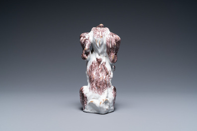 A Brussels faience manganese and white dog, 18th C.
