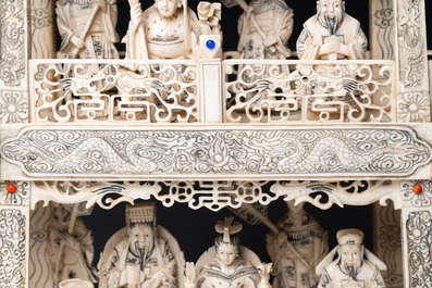 A Chinese carved ivory dragon boat on wooden stand, 19th C.