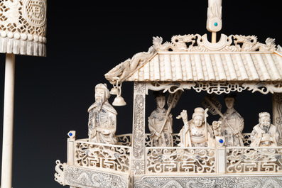 A Chinese carved ivory dragon boat on wooden stand, 19th C.