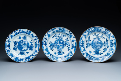 Three Chinese blue and white dishes with raised central medallions, Kangxi