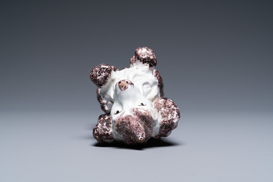 A Brussels faience manganese and white dog, 18th C.