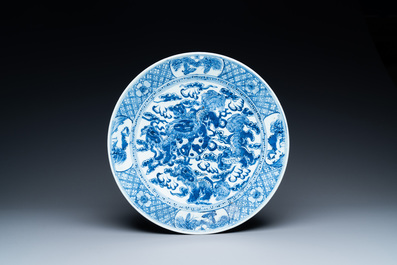 Three Chinese blue and white dishes with dragons, phoenixes and Buddhist lions, 19th C.