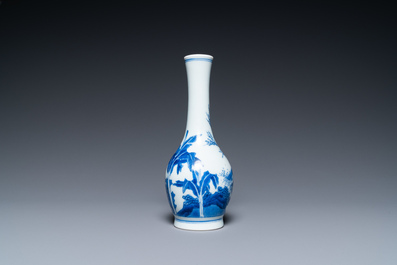 A Chinese blue and white bottle vase with a lady and her servant in a landscape, Transitional period