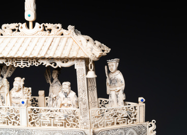 A Chinese carved ivory dragon boat on wooden stand, 19th C.