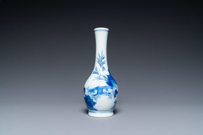A Chinese blue and white bottle vase with a lady and her servant in a landscape, Transitional period