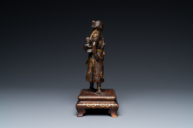 A Japanese patinated and gilded bronze figure of a warrior, signed Miyao, Meiji, 19th C.