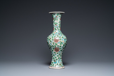 A Chinese verte biscuit 'peony scroll' vase, Ming