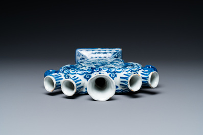 A Dutch Delft blue and white heart-shaped tulip vase with putti, 1st half 18th C.