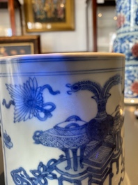 A Chinese blue and white brush pot with a landscape and antiquities, Kangxi