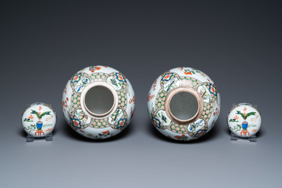 A pair of Kangxi-style famille verte jars and covers, Samson, France, 19th C.