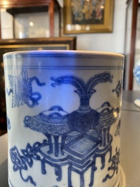 A Chinese blue and white brush pot with a landscape and antiquities, Kangxi