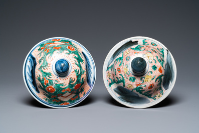 A pair of Chinese wucai 'galloping horses' vases and covers, Transitional period