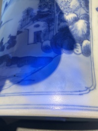 A Chinese blue and white brush pot with a landscape and antiquities, Kangxi