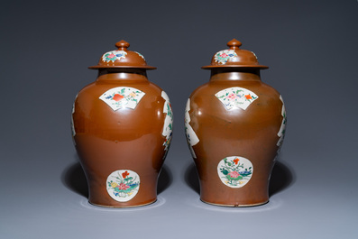 A pair of Chinese famille rose capucin brown-ground vases and covers, Qianlong
