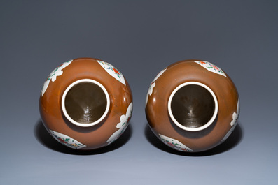 A pair of Chinese famille rose capucin brown-ground vases and covers, Qianlong