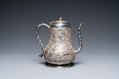 A Chinese silver teapot with birds among blossoming branches, 19th C.