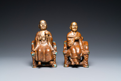 A pair of Chinese partly gilded seated figures, Zeng Long Sheng Zao mark, 20th C.