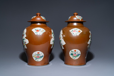 A pair of Chinese famille rose capucin brown-ground vases and covers, Qianlong
