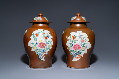 A pair of Chinese famille rose capucin brown-ground vases and covers, Qianlong