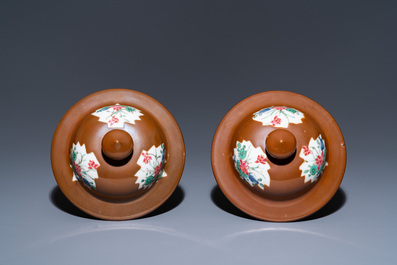 A pair of Chinese famille rose capucin brown-ground vases and covers, Qianlong