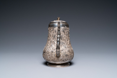 A Chinese silver teapot with birds among blossoming branches, 19th C.