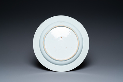 A Chinese famille rose 'cranes' dish and four armorial plates, Qianlong
