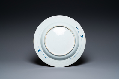A Chinese blue and white dish with a boy on a terrace, Kangxi