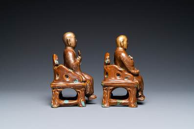 A pair of Chinese partly gilded seated figures, Zeng Long Sheng Zao mark, 20th C.