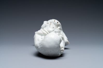 A Chinese Dehua blanc de Chine figure of Liu Hai with the toad, Kangxi