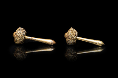 Three Vietnamese golden earrings, Champa, 14th C. and a pair of later Chinese gilded earrings, 18/19th C.