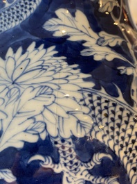 A pair of Chinese blue and white 'dragon and peony' vases, 19th C.
