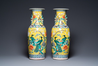 A pair of Chinese yellow-ground famille rose vases, 19th C.