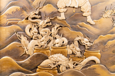 A large Japanese wooden screen with a central gilt-lacquered and ivory-inlaid panel, Meiji