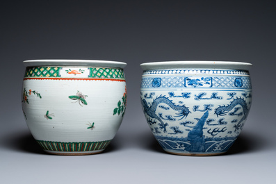A Chinese blue and white 'dragons' fish bowl and a famille verte 'magpies' fish bowl, 19th C.