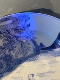 A Chinese blue and white plate with two men in a landscape, Kangxi